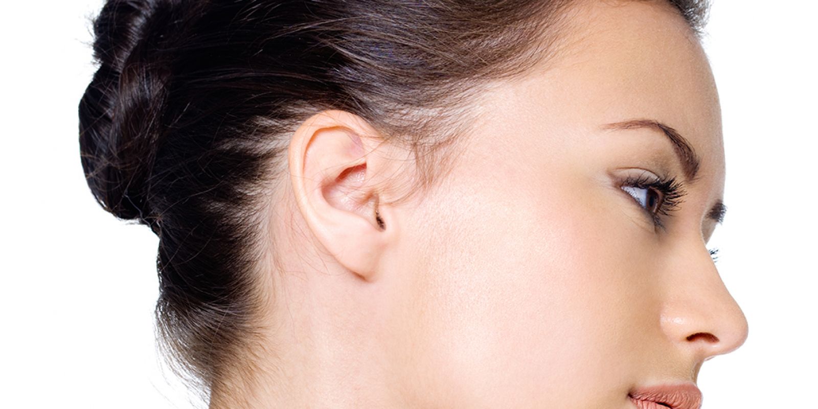 Model With Hair in Bun Looking Out to the Side