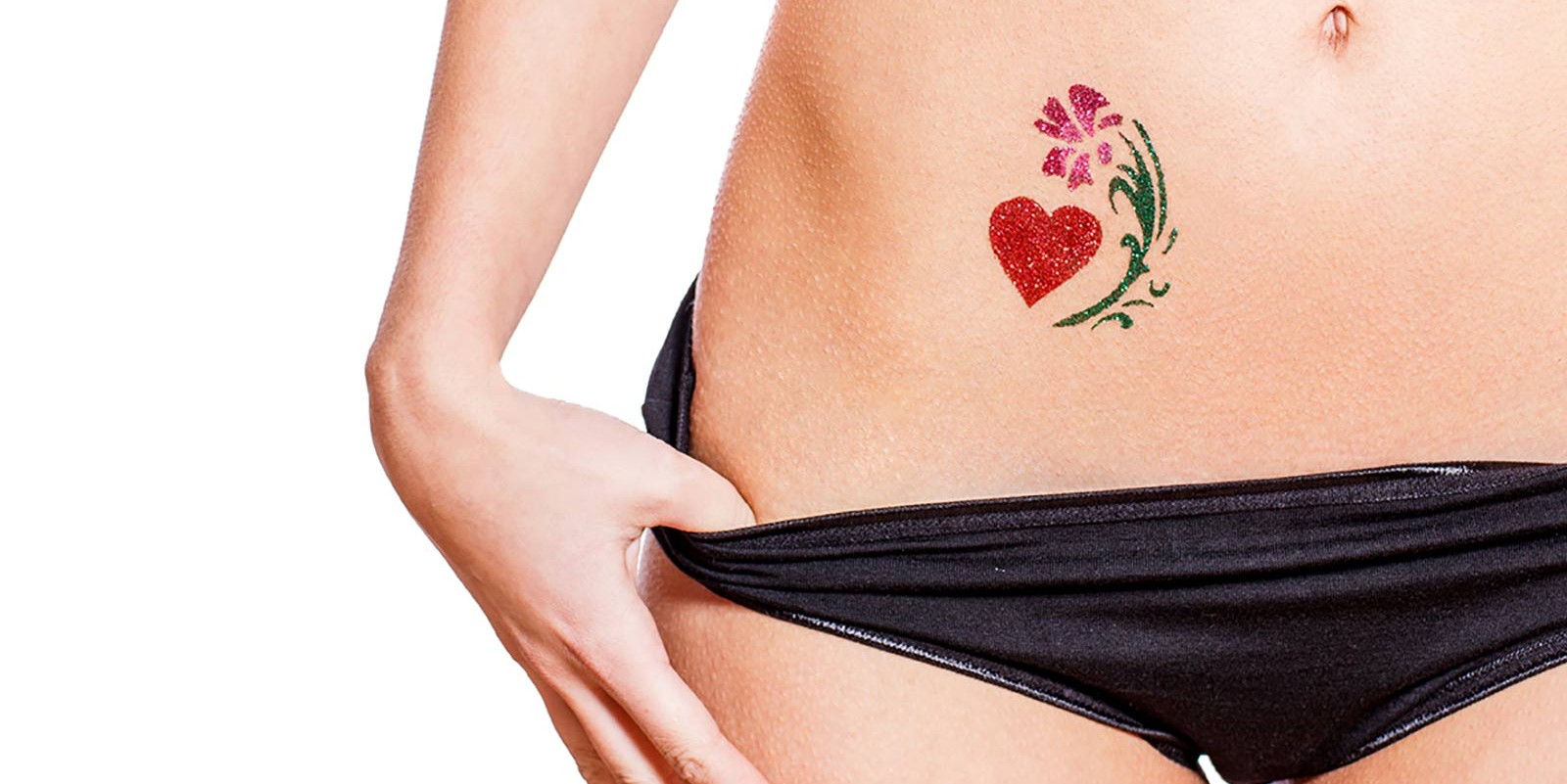 Shot of Female Lower Torso With Heart Tattoo on Belly