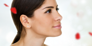 Close Up of Female Face With Floating Rose Petals