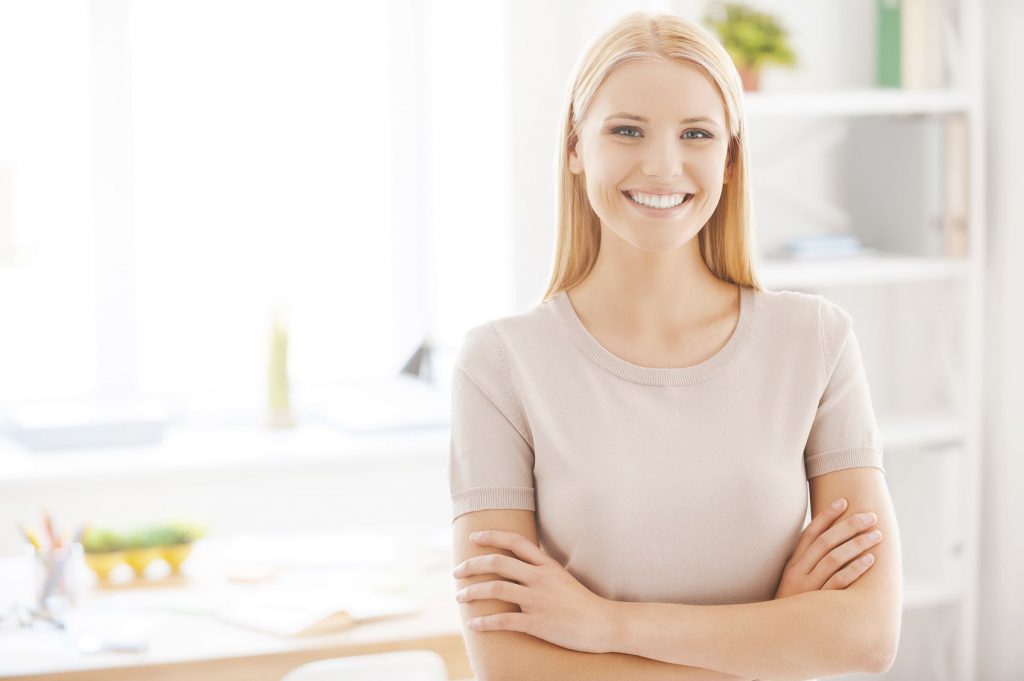 Smiling Blond Female In Beige T-shirt